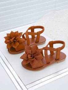 1 Paio di Sandali Piatti Marroni con Cinturini Floreali, Minimalisti con Cinturino Incrociato alla Caviglia, Punta Tonda con Suola Morbida, Sandali Casual Chic alla Romana, Adatti per Ragazze e Donne di Età Compresa tra 5-15 Anni, per Uso Quotidiano, Vacanze, Feste, Nuovi Arrivi Primavera/Estate 2026 - Castano - Visualizzare 2