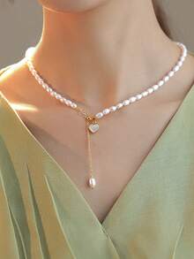 1件高品质铜珠金色心形吊坠串珠项链，适合女性日常、休闲、派对佩戴，也是秋冬季女士珠宝配饰、圣诞礼物、情人节礼物、送给女朋友的礼物、送给妈妈的礼物。 - 白色 - 查看 3