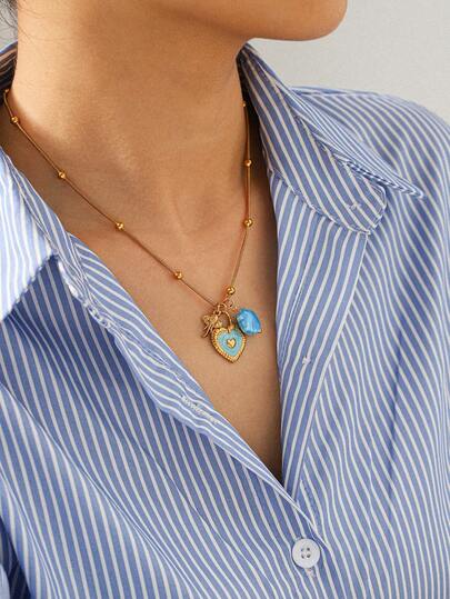 1件陶瓷贝壳大象吊坠项链，配油滴心形锁扣设计，适合女性日常佩戴