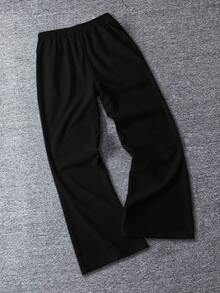 Disney Pantalones deportivos casuales sueltos con estampado asimétrico gráfico de Mickey Mouse en inglés para hombres