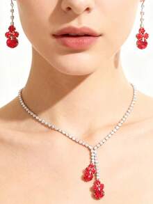 طقم مجوهرات أسلوب بوهيمي مرصع بالراين الأحمر، طقم قلادة من الزركونيا المكعبة فائقة اللمعان وأقراط من الفولاذ المقاوم للصدأ، طقم مجوهرات عيد الميلاد لشهر ديسمبر، مناسب للزفاف والحفلات والسهرات - الأحمر - مشاهدة 2