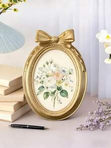Khung ảnh nhựa cao cấp này có các chi tiết dập nổi, lớp hoàn thiện mạ vàng bóng bẩy và có thể hiển thị một bức ảnh theo chiều dọc. Sản phẩm đi kèm với giá đỡ để bàn và thiết kế nơ độc đáo, cùng một khe cắm thẻ hình chữ nhật. Đây là sự lựa chọn hoàn hảo cho trang trí nhà cửa và văn phòng! Phù hợp cho trang trí nhà cửa, phòng ngủ, văn phòng và học sinh, trang trí đám cưới, trang trí tiệc tùng, và cũng là một món quà tuyệt vời. - Nhiều màu - Xem 9