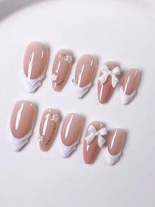 10 Pieces Of Handcrafted Press On Nails Stiletto, Press On Short Nails, Almond Nails, Hand-Pulled Gel With Hand-Painted Golden Glitter Coils, White Small Flower Ornaments And White Bow Decorations On Nude Pink Nail Surface;The Cute Nails Are Suitable For Ladies And Girls To Wear To Parties And Daily Use As Fall Press On Nails.