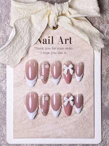 10 Pieces Of Handcrafted Press On Nails Stiletto, Press On Short Nails, Almond Nails, Hand-Pulled Gel With Hand-Painted Golden Glitter Coils, White Small Flower Ornaments And White Bow Decorations On Nude Pink Nail Surface;The Cute Nails Are Suitable For Ladies And Girls To Wear To Parties And Daily Use As Fall Press On Nails.