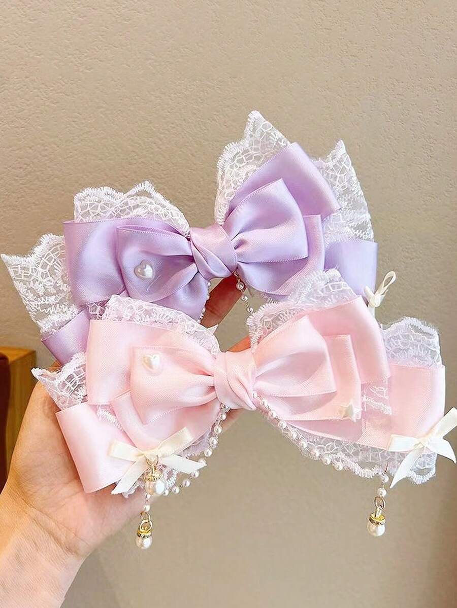 1 chiếc kẹp tóc Lolita màu hồng hình nơ ren đính ngọc trai tua rua lưới, kiểu dáng dễ thương mùa xuân, phù hợp để sử dụng hàng ngày.