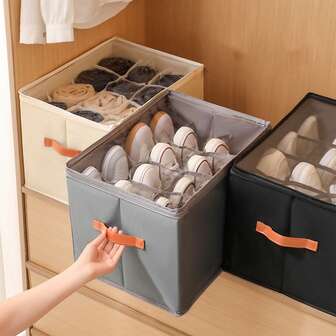 La caja de almacenamiento de zapatos es plegable con tapa y visible. Es una caja multifuncional con compartimentos para guardar ropa, artículos varios, etc.