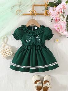 Đầm mùa hè dễ thương in hoa, cổ tròn, tay phồng, trang trí nơ. - Màu xanh lá cây đậm - Xem 1
