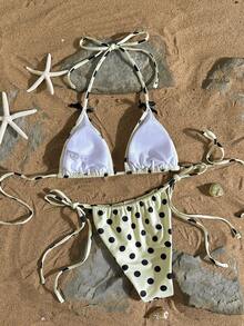 Bộ bikini 2 mảnh dành cho nữ, gồm áo hai dây màu vàng hở lưng phối họa tiết chấm bi đen ngẫu nhiên và nơ đen buộc bên hông, thích hợp cho mùa xuân, hè, lễ Phục sinh, ngày Thánh Patrick, đi chơi, tốt nghiệp, và những dịp nghỉ dưỡng sang trọng trên bãi biển. - Nhiều màu - Xem 9