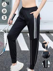 Calça de corrida feminina de cintura alta, com bolsos inclinados, modelo minimalista de cor sólida e corte afunilado, com listras pretas e brancas e cintura elástica. - Preto e Branco - Ver 4