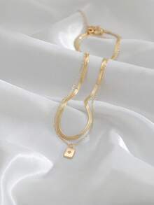 Nooxian 2 piezas Collar colgante de doble capa con cuchilla de acero inoxidable, cadena cuadrada de cobre con micro-incrustación de circonita brillante - Amarillo Oro - Ver 10