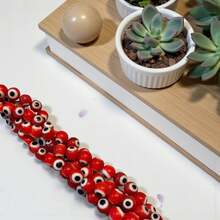 1 Tira de 36 cm de ojo turco, ojo del mal de 6mm, para la elaboración de pulseras y collares - Rojo - Ver 1