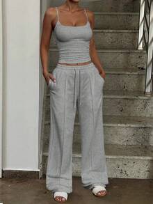 Bộ đồ thể thao tối giản màu trơn gồm áo tank top và quần jogger cạp chun, thích hợp cho mùa hè. - Màu Xám nhạt - Xem 5