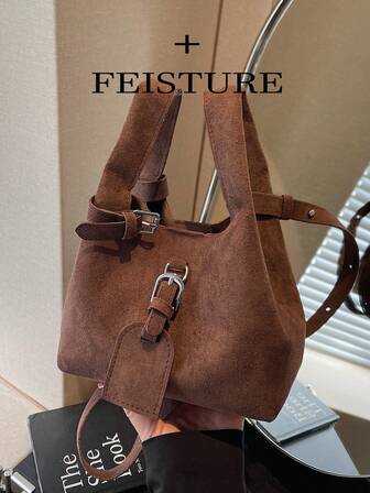 1个麂皮绒纯色手提包，复古磁扣，单肩水桶包，适合女孩、女士、大学生、年轻职业人士，非常适合工作、商务、通勤和上学使用。