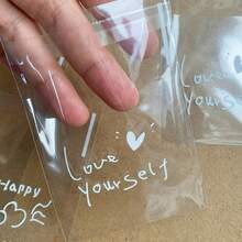 Khoảng 100 túi quà tặng tự dính hình trái tim trong suốt 4 trong 1, in hình câu nói truyền cảm hứng - Túi quà tặng bằng nhựa, thích hợp cho sinh nhật, đám cưới, ngày lễ - Túi đựng quà nhỏ tái sử dụng, túi quà tặng, túi quà tặng ngày lễ, thiết kế hình trái tim, túi tự dán. - Trong sáng - Xem 7