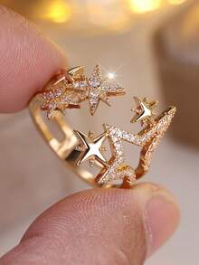 Vanel An Elegant Open Ring From The Star Collection For Women - A Stylish And Minimalist Design, Featuring A Sparkling Cubic Zirconia Stone And A Golden Yellow Open Shape, Suitable For Everyday Wear And As A Gift.