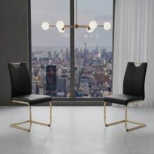 Two Black Chairs With Gold Legs