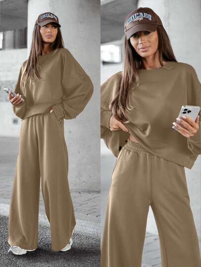 两件套女士纯色圆领长袖T恤和高腰阔腿裤套装，适合秋冬季日常穿着。