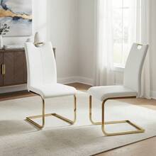 Two White Chairs With Gold Legs