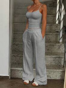 Bộ đồ thể thao tối giản màu trơn gồm áo tank top và quần jogger cạp chun, thích hợp cho mùa hè. - Màu Xám nhạt - Xem 6