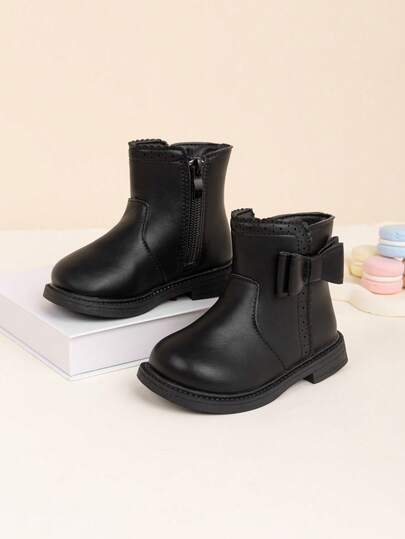 1双儿童时尚纯色PU踝靴，带蝴蝶结设计，适合春秋季穿着