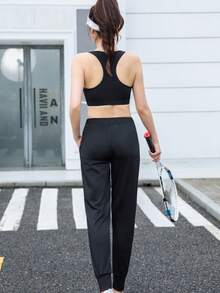 Calça de corrida feminina de cintura alta, com bolsos inclinados, modelo minimalista de cor sólida e corte afunilado, com listras pretas e brancas e cintura elástica. - Preto e Branco - Ver 3