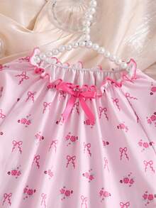 Este dulce, elegante y casual conjunto de ropa de estar en casa de manga larga está diseñado especialmente para niñas. Presenta un cuello redondo con estampado de lazos rosas y un bajo recogido, creando un estilo de princesa cómodo. Es muy adecuado para usar en casa, leer, descansar y relajarse. También es un gran regalo para niños o amigos. - Rosa - Ver 6