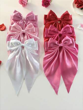 6个优雅纯色粉色布艺蝴蝶结弹力发夹，适合扎马尾辫、搭配连衣裙、度假、日常佩戴，是理想的发饰。