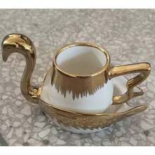 1 set Juego de taza y platillo de té con forma de animal dorado - Diseño elegante de camello y cisne, vajilla de té de cerámica de lujo con acentos metálicos, perfecto para decoración del hogar única y regalo para entusiastas del té