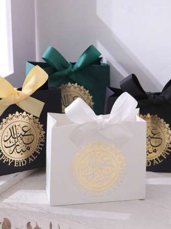 Five Exquisite Little Eid Gift Boxes, Each In Elegant Black, Luxurious Green, And Pure White, Are Adorned With Delicate Gold Circles Of Arabic Script And Tied With Luxurious Gold And Silver Ribbons. Perfect For Storing Sweets, Chocolates, And Small Gifts, These Boxes Are Crafted From Premium Materials And Create Stunning Packaging For Special Occasions.