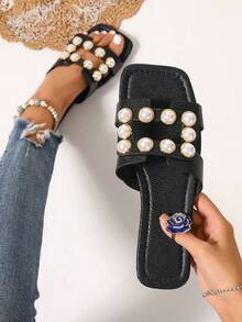 Ximi Ruo Nuevas sandalias de moda casual de primavera/verano con una correa, cómodas sandalias planas de punta redonda para la playa, versátiles sandalias slip-on para mujer - Negro - Ver 1