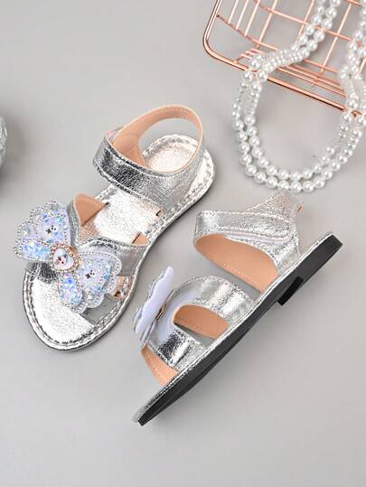 1双女童蝴蝶结甜美可爱公主风平底凉鞋，防滑、耐穿、轻便舒适，适合休闲、派对、户外活动穿着。