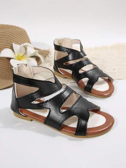 这款适合3至15岁男孩女孩的纯色魔术贴软底凉鞋，轻便休闲，防滑，露趾设计，款式简约平底。适合日常穿着和夏季海滩活动。