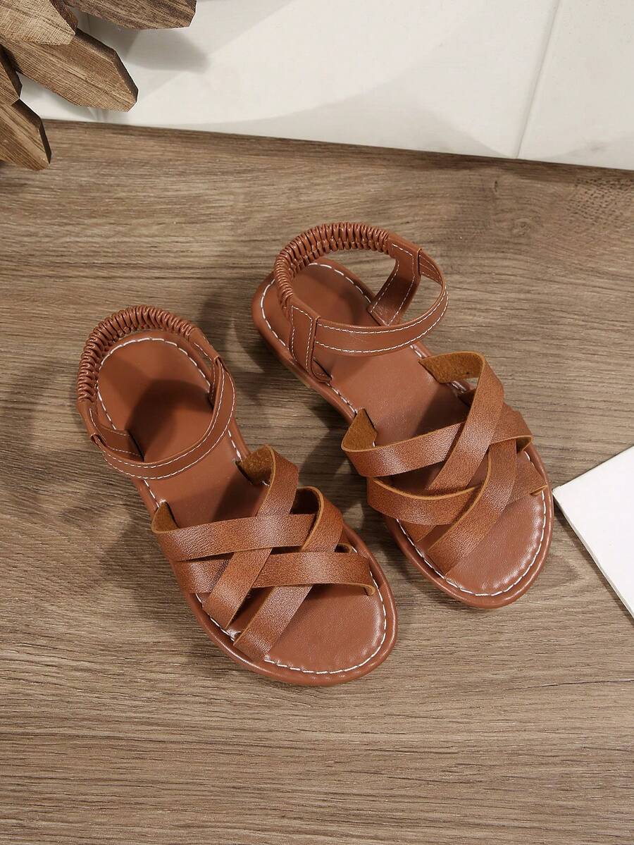 A Pair Of Children's Sandals, 2026 Summer New Style, Fashionable And Versatile, Round-Toed Flat, Anti-Slip, Black, White, Brown, Gold, Orange, Slip-On On The Beach, Roman Sandals For Outerwear - Brown - View 1