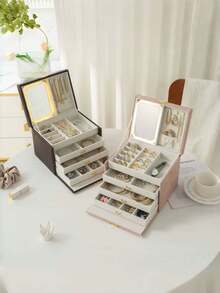 JewelryStorageBoxLEDMirror 这款四层LED化妆镜配备珠宝宝石收纳空间和内置照明。它拥有三种照明模式、触控功能、便携式支架和可折叠的紧凑型镜框。内置1000mAh可充电电池，是一款便携式LED化妆镜，非常适合旅行携带。它是送给女性的理想礼物，也是情人节和母亲节的完美之选。 - 彩色 - 查看 8