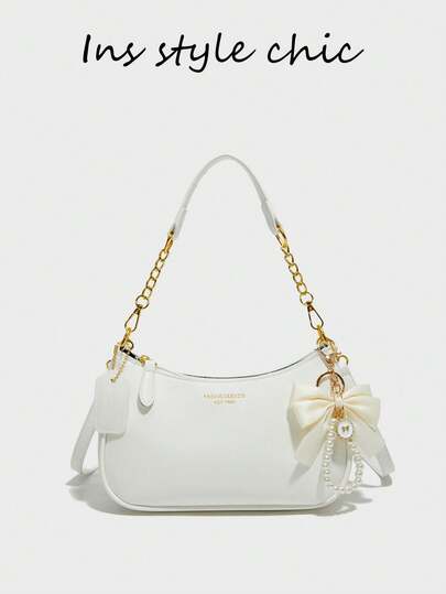 This Women's Shoulder Bag Is Made Of Solid Color PU Material, Decorated With Letter Accents, Bow, And Pearl Pendant, Exuding A Fashionable Vibe. The Bag Features A Zipper And Metal Chain Design, Making It Stylish And Versatile. It Can Be Easily Worn Across The Body To Elevate Your Overall Look. The Spacious Interior Can Accommodate Daily Essentials Like Lipstick, Keys, Cosmetics, Etc., Suitable For Commuting, Outings, Dates, Shopping, And Various Everyday Occasions For Women.