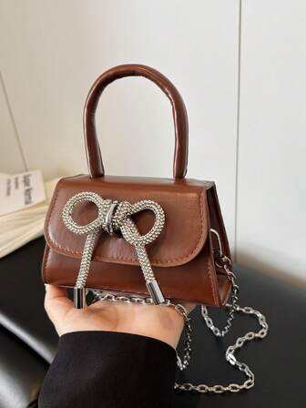 Bolso de mano mini con lazo de rhinestone para mujer, elegante bolso de hombro con cadena, bolso cruzado de piel de PU, bolso de hombro de mujer de otoño e invierno 2025