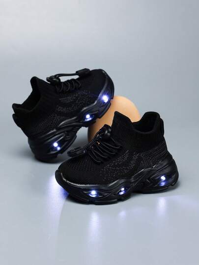 1 par de zapatos deportivos de tela con cordones a rayas y luces LED en las suelas para niños, zapatillas de moda para exteriores, de fácil puesta, antideslizantes