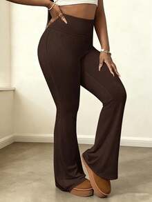 Pantalones de yoga acampanados y elásticos de cintura alta para mujer que estilizan la figura