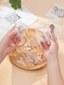 100个装高品质首饰收纳袋，透明首饰袋，防氧化首饰密封袋，适用于耳环、项链、手链和戒指 - 防褪色，小巧透明拉链袋，适合存放小型首饰 - 非常适合节日送礼 - 彩色 - 查看 6