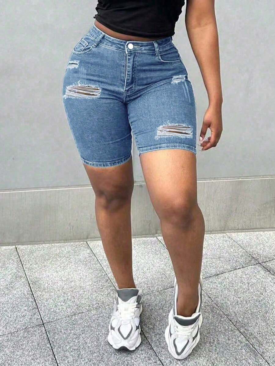 Shorts jeans skinny rasgados com detalhe de bigode de gato, estilo casual de verão, que realçam as curvas. Perfeitos para férias, praia, festivais de música, viagens e outras ocasiões. Exibindo o estilo jeans. - Lavagem Média - Ver 1