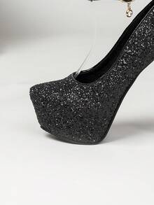 5.5英寸（14厘米）高跟女式时尚浅口鞋，黑色漆皮材质，柔软舒适，蝴蝶结装饰细高跟，优雅性感，单带设计，穿着稳固，适合T台走秀、正式活动、约会、派对和夜店等场合。 - 黑色 - 查看 9