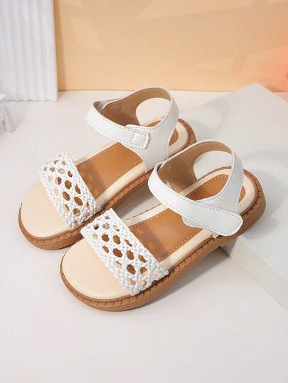 1 Pair Girls' Open Toe Sandals, White Woven Hollow Lace-Up Design With Decorative Elements, PU Material, Soft And Easy To Wear, Low-Top Style With Hook And Loop Strap, Flat, Versatile And Artistic, Suitable For Daily Wear And Short Trips