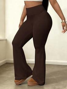 Pantalones de yoga acampanados y elásticos de cintura alta para mujer que estilizan la figura