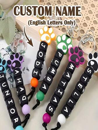 Llavero personalizado de silicona con cuentas y diseño de huella de perro y letras en inglés - Accesorio antiperidida personalizado para mujeres, diseño de cuentas de colores, regalo perfecto para amantes de las mascotas, accesorios para amantes de las mascotas | Llavero de colores | Cuentas de silicona, cuentas de personajes de silicona
