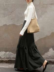 2025时尚日报优雅街头通勤纯色拉链拼接女式长裙，适合春、秋、冬季穿着