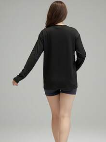 Camiseta deportiva casual y holgada para mujer con cuello redondo y mangas largas, adecuada para otoño e invierno. - Negro - Ver 5