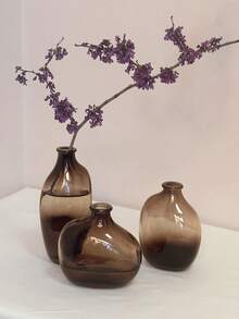 一套1个不对称几何玻璃花瓶，瓶口小巧，渐变棕色。适合家居客厅或玄关装饰，也是返校季房间装饰和文具收纳的理想花瓶。冬季装饰佳品。可用于浴室、卧室、商店、展览、派对等场合。复古、简约、北欧、中性、高端、时尚。情人节、新年、斋月或开斋节的完美之选。 - 棕色 - 查看 6