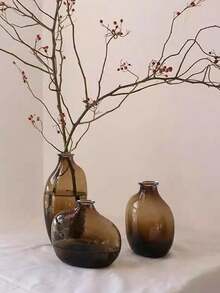 一套1个不对称几何玻璃花瓶，瓶口小巧，渐变棕色。适合家居客厅或玄关装饰，也是返校季房间装饰和文具收纳的理想花瓶。冬季装饰佳品。可用于浴室、卧室、商店、展览、派对等场合。复古、简约、北欧、中性、高端、时尚。情人节、新年、斋月或开斋节的完美之选。 - 棕色 - 查看 3