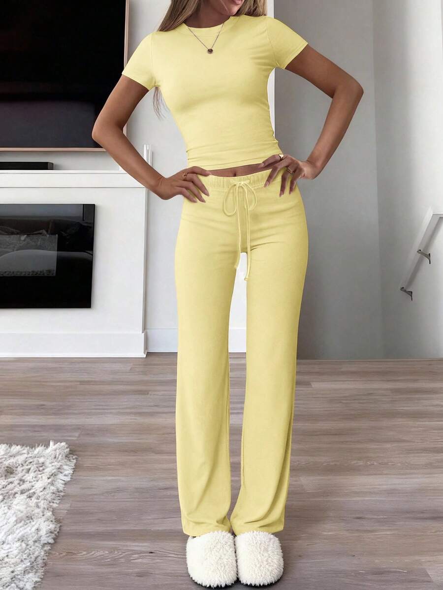 Bộ đồ thể thao mùa hè phong cách Y2K dành cho nữ của GAOVOT, bao gồm áo thun cổ tròn tay ngắn màu trơn và quần ống đứng ôm sát. - Màu vàng - Xem 1