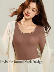 女士无缝黑色粉色超薄纯色保暖内衣，保暖舒适，长袖圆领无缝打底衫，修身高弹。女士米色薄纱打底衫，休闲纯色轻薄保暖，适合秋冬季节，轻薄基础款打底衫，时尚日常穿着。 - 棕色 - 查看 5